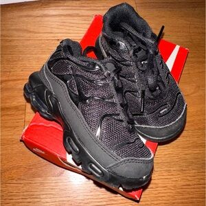 Black Nike kids sneakers